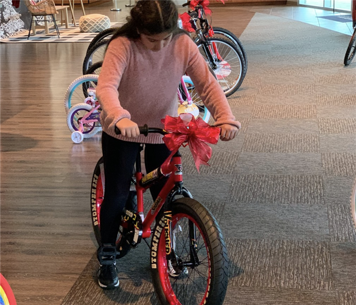 Girl on bike.