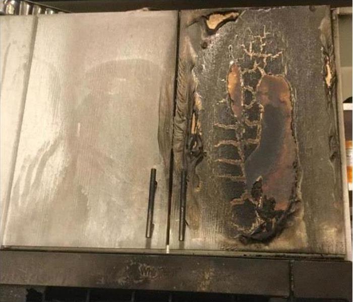 Kitchen cabinet burned, melted door of a kitchen cabinet